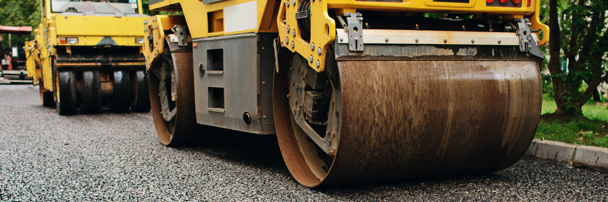 Background of asphalt roller that stack and press hot asphalt. Road repair machine